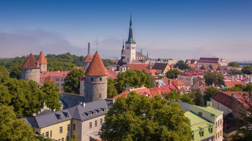 Cityscape of Toompea limestone hill in Tallinn, Estonia with a bright blue sky in the background
