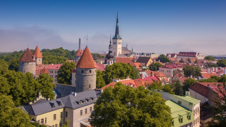 Cityscape of Toompea limestone hill in Tallinn, Estonia with a bright blue sky in the background