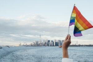 Hand waving LGBT flag in NYC, USA