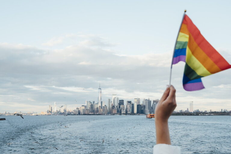 Hand waving LGBT flag in NYC, USA