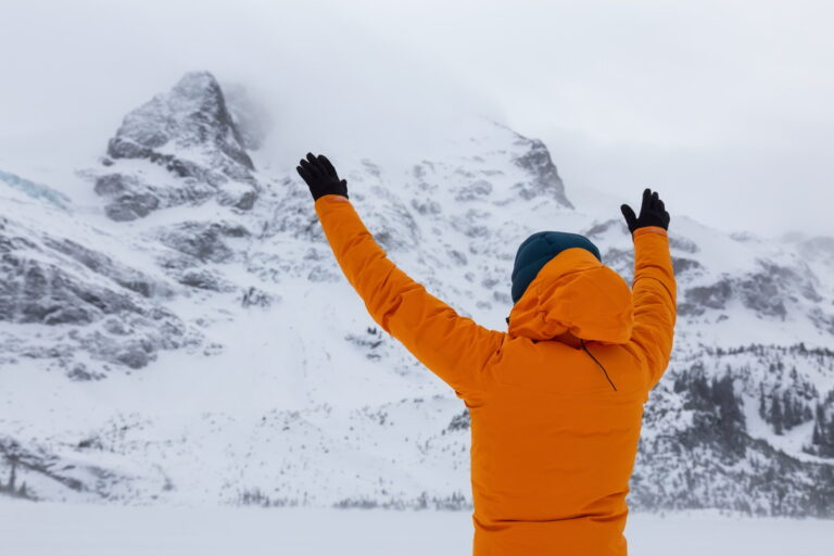 Man hiking in snow. Canadian Nature Landscape