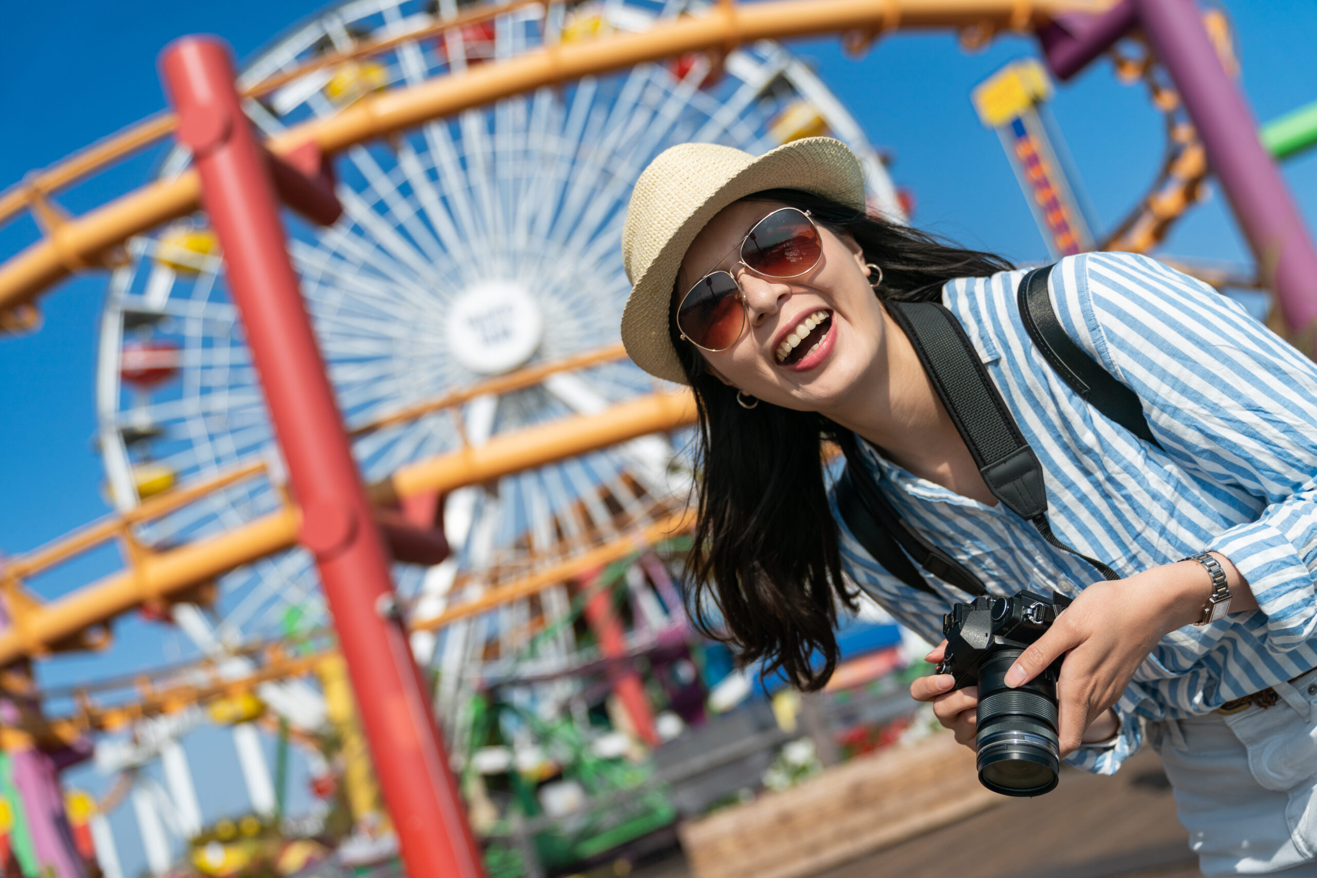 lady with camera on vacation at the park